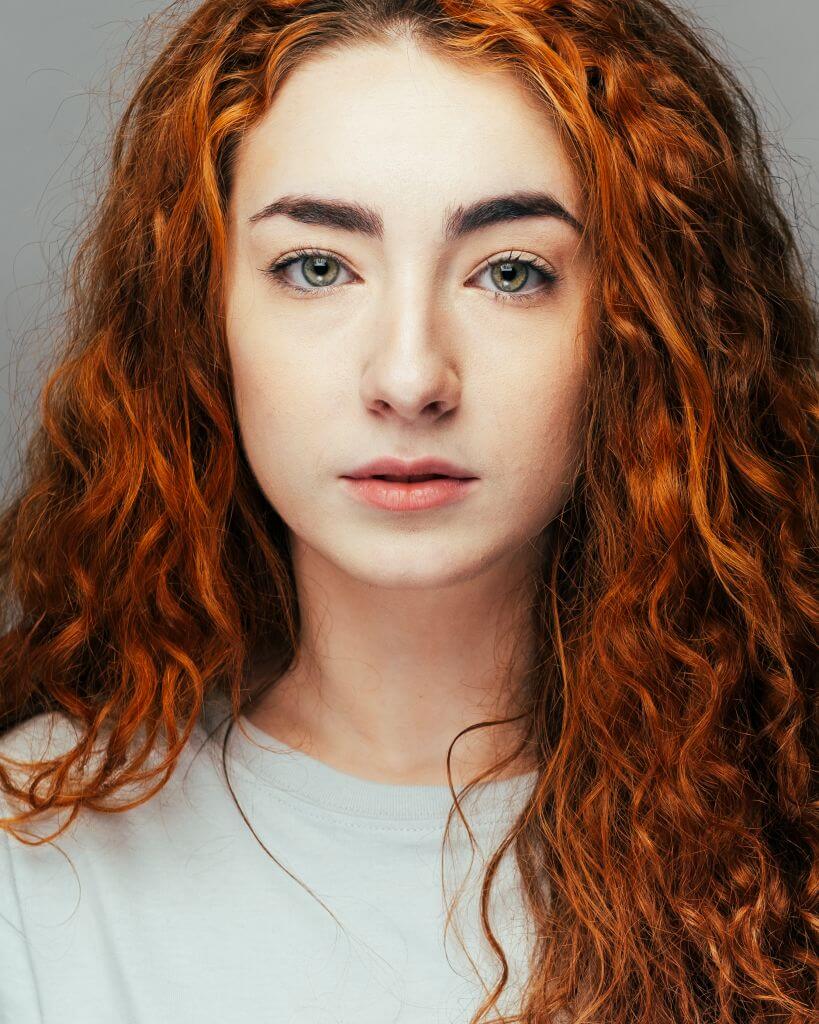 White female with red hair portrait headshot photograph