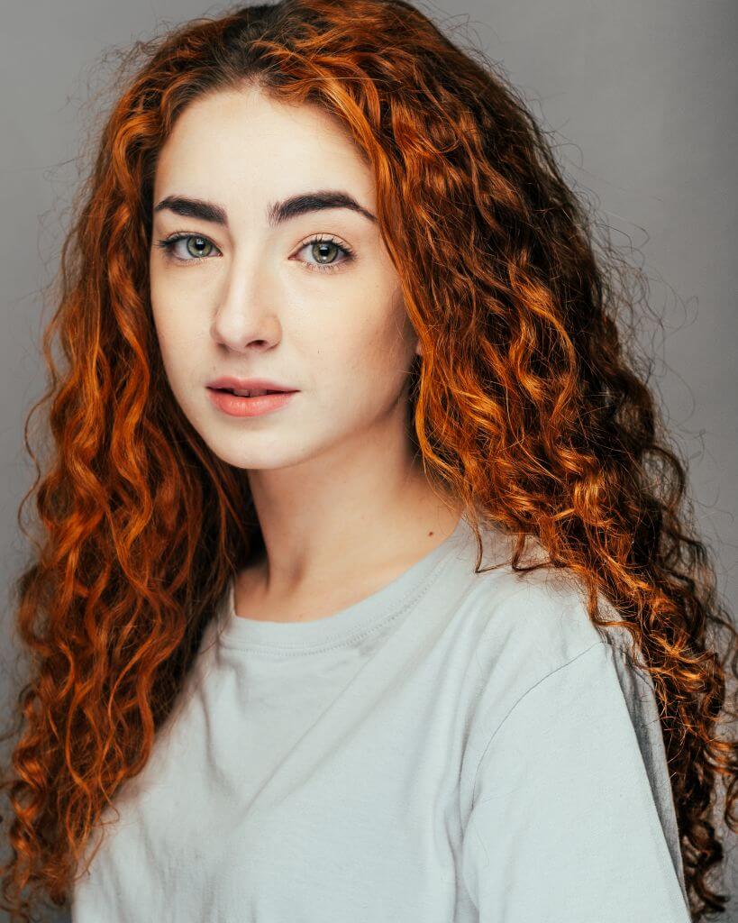 White female with red hair portrait headshot photograph
